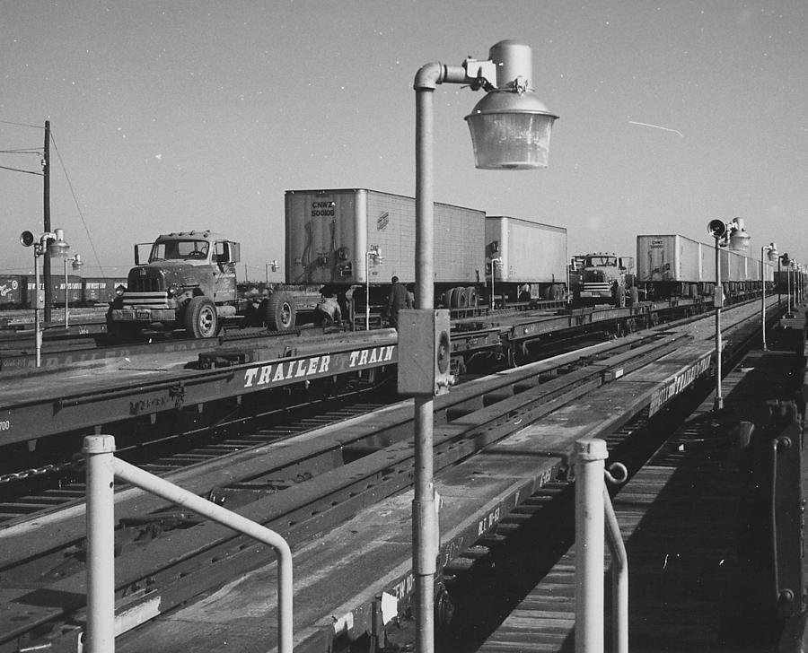 Unloading Trailer From Flat Rail Car Photograph by Chicago and North Western Historical Society