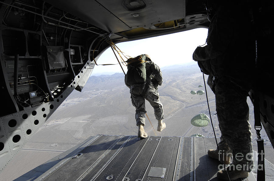 U.s. Airmen Jump From A Ch-47 Chinook Photograph by Stocktrek Images