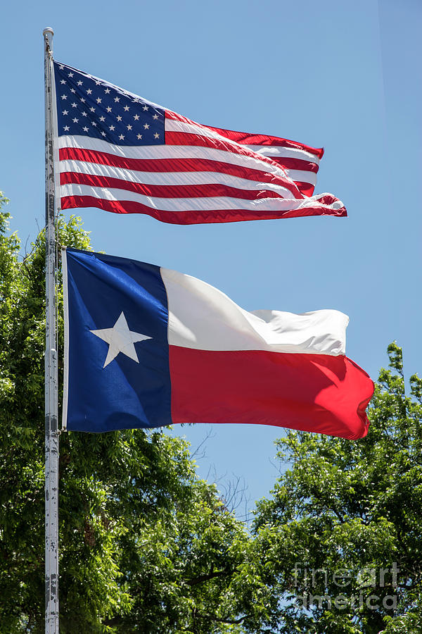 Flag Photograph - U.S. and Texas flags flying in the breeze of the Lone Star State by Dan Herron