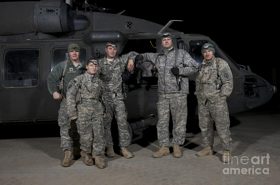 U.s. Army Crew Chiefs Pose In Front Photograph by Terry Moore