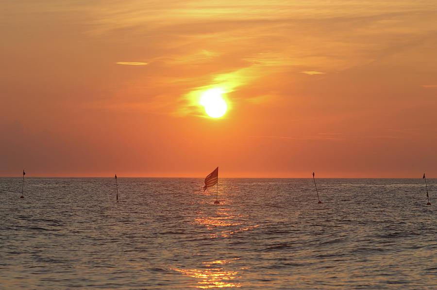 US Flag Floating At Sunrise Photograph by Robert Banach