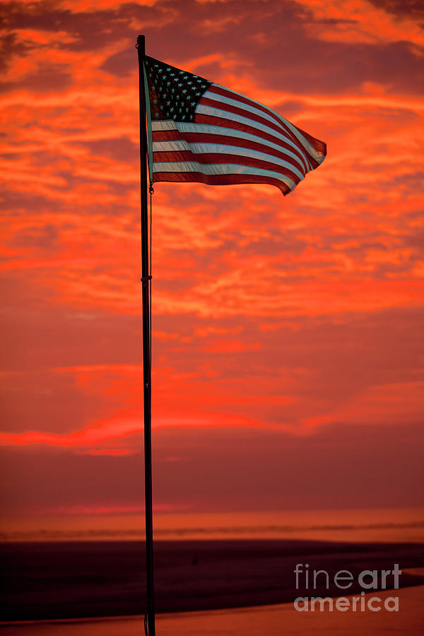 US Flag with dramatic  Fire Sky sunrise Photograph by Anthony Totah