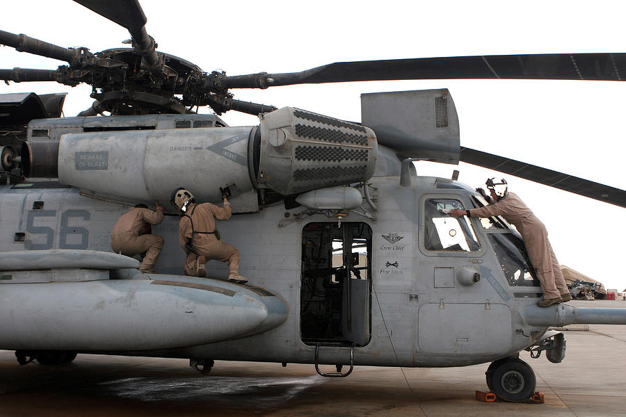 Helicopter Photograph - U.s. Marines Perform Preflight Checks by Stocktrek Images