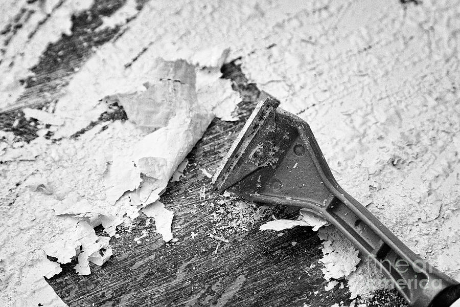 Using Blade Scraper To Scrape Off Paint Bubbling Up Due To Application