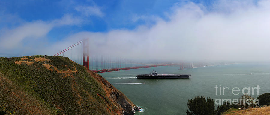 USS Nimitz CVN-68 tucks under the fog of the Golden Gate Bridg Photograph by Wernher Krutein