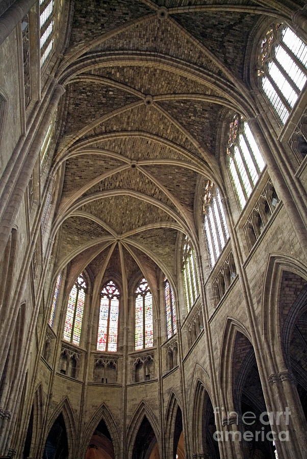 Vaulted ceilings and stained glass windows of Saint Andre Cathedral in ...