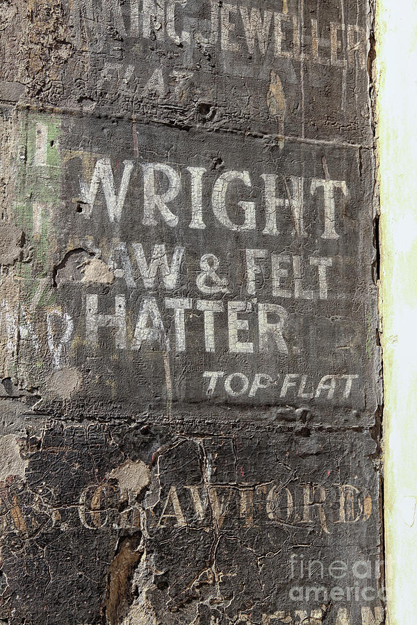 Very old business names painted on wall in Edinburgh Photograph by Patricia Hofmeester
