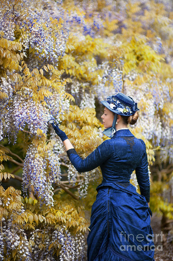 Victorian Woman Admiring Wisteria Flowers Photograph by Lee Avison