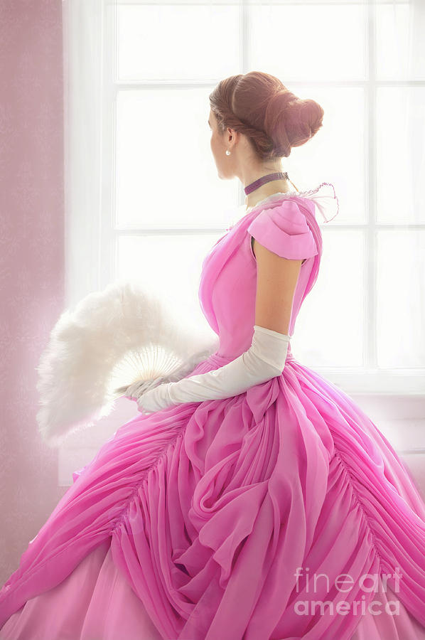 Victorian Woman In A Pink Dress Looking Out Of The Window Photograph by Lee Avison