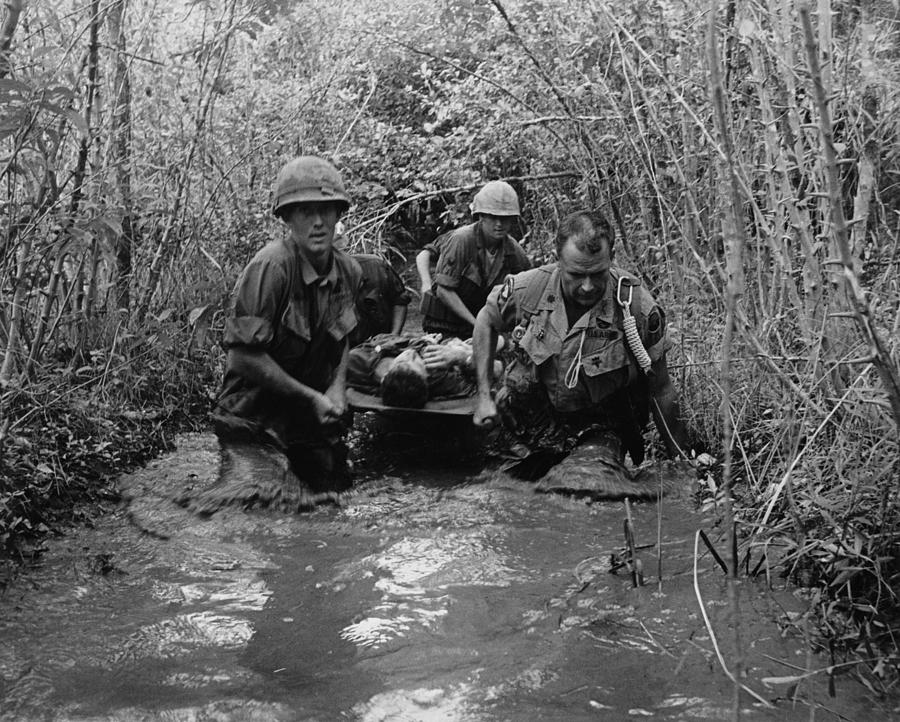 Vietnam War. Us Soldiers Carry Photograph by Everett