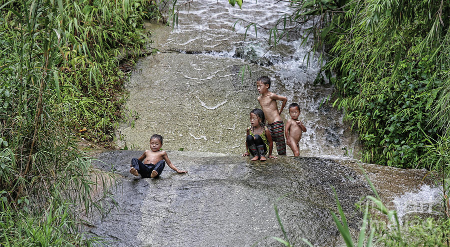 Vietnamese Children Water slide  Photograph by Chuck Kuhn
