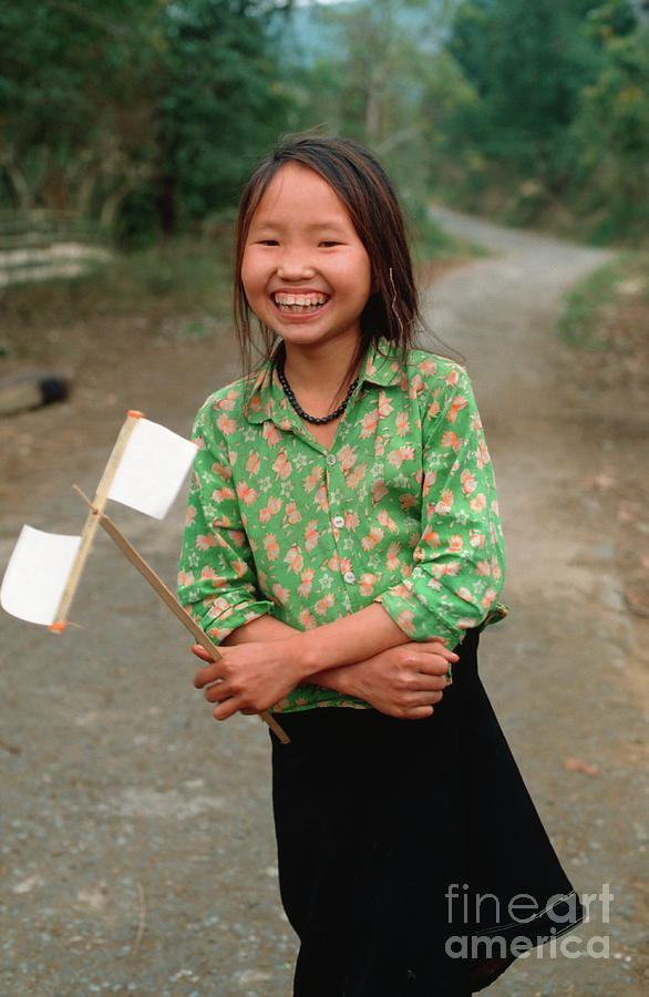 Vietnamese girl with white paper flags Photograph by Silva Wischeropp