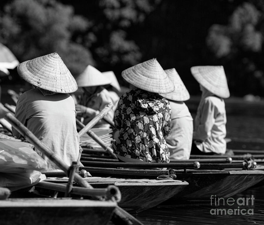 Vietnamese tour guides wait bw Photograph by Chuck Kuhn