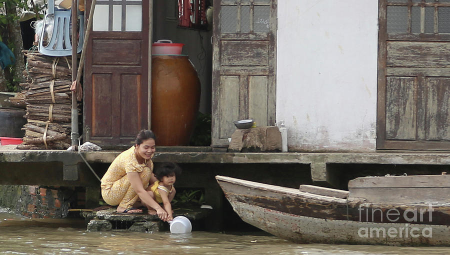 Nature Photograph - Vietnamese Woman Child Home on River  by Chuck Kuhn