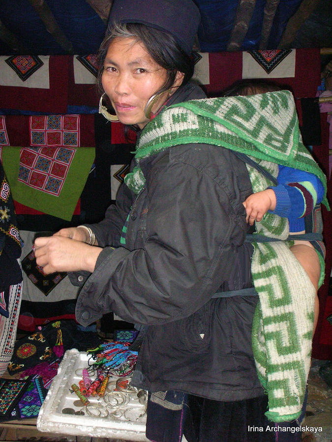 Vietnamese woman with child on back  Photograph by Irina ArchAngelSkaya