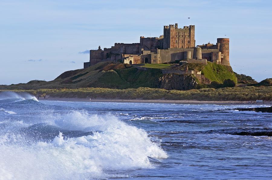 View From Ocean Of Bamburgh Castle Photograph by Axiom Photographic
