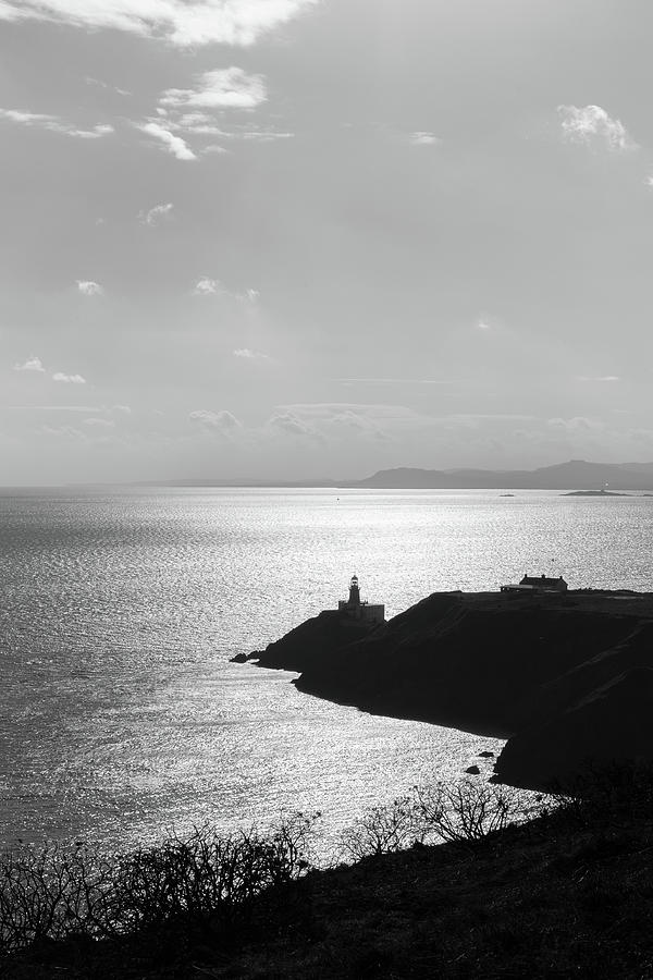 View of Howth Head with the Baily Lighthouse in black and white Photograph by Semmick Photo