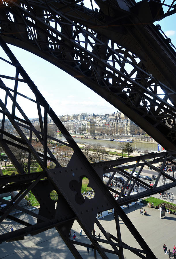 View of River Seine through the Iron Struts of the Eiffel Tower Paris France Photograph by Shawn OBrien