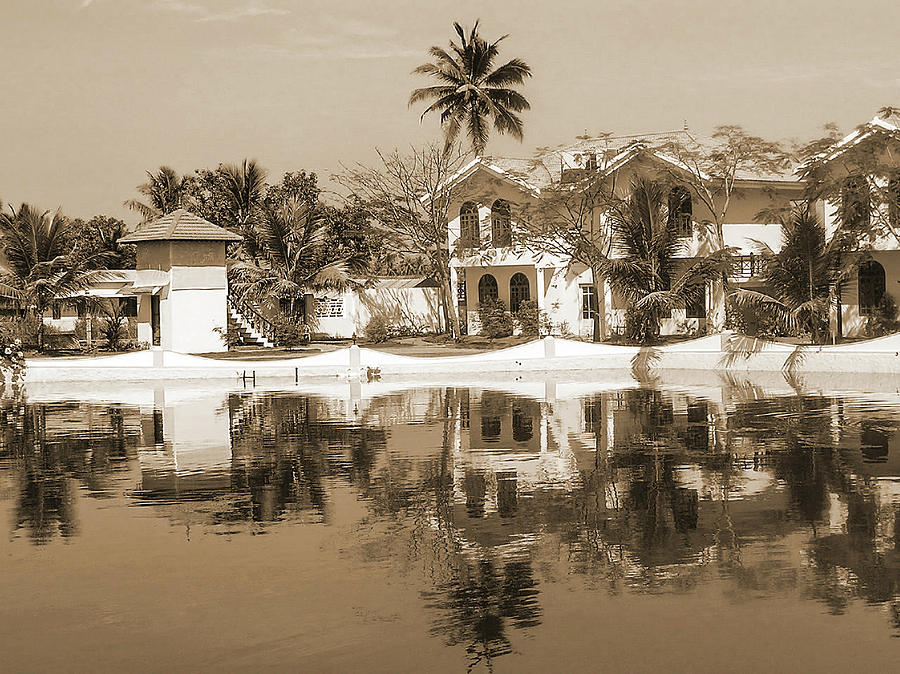 View of the cottages and lagoon water Photograph by Ashish Agarwal