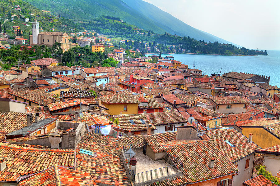 view over the red roofs of Malcesine at the east bank of the Lake Garda Photograph by Gina Koch