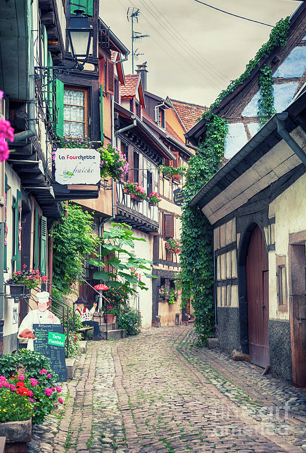 village street  in Eguisheim in Strasbourg region , Alsace, augu Photograph by Ariadna De Raadt