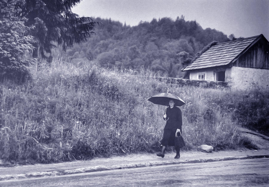 Umbrella Photograph - Villager in Rain by Don Wolf