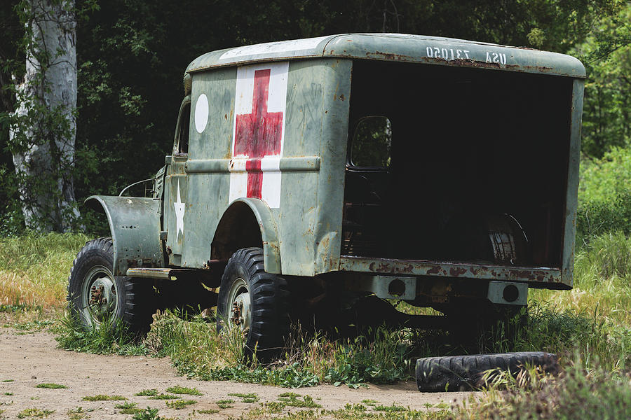 Abandoned Vintage Ambulance in Forest Photograph by Martin Alonso ...