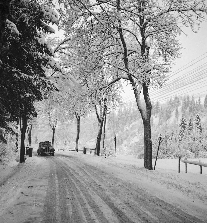 Vintage Car on a Winter Road Photograph by German School