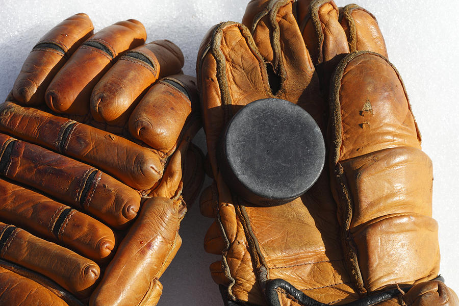 Vintage ice hockey gloves and puck Photograph by Ulrich Kunst And Bettina Scheidulin