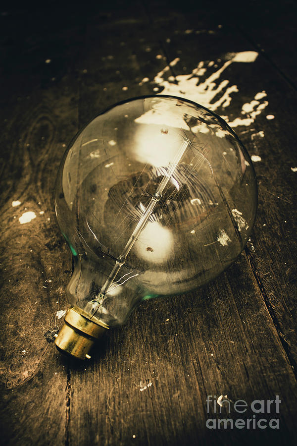 Vintage Light Bulb On Wooden Table Photograph