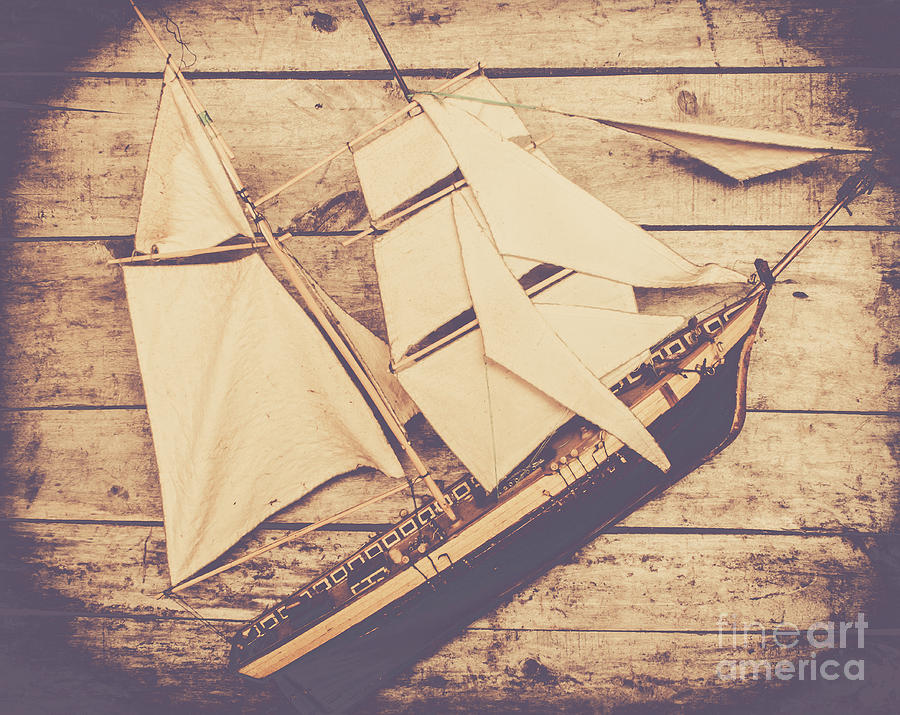 Vintage mini ship on wooden background Photograph by Jorgo Photography