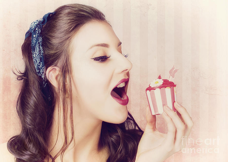 Vintage pin up girl eating strawberry cupcake Photograph by Jorgo Photography