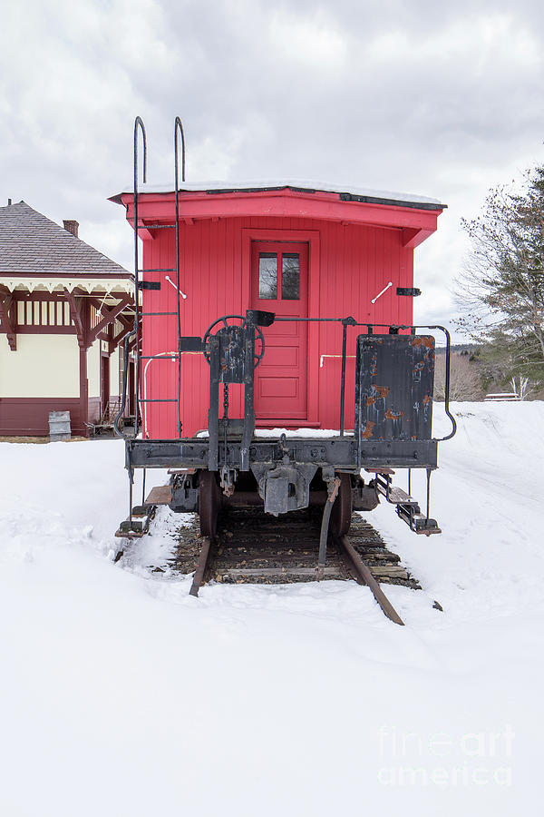 Vintage Red Caboose in the snow Photograph by Edward Fielding