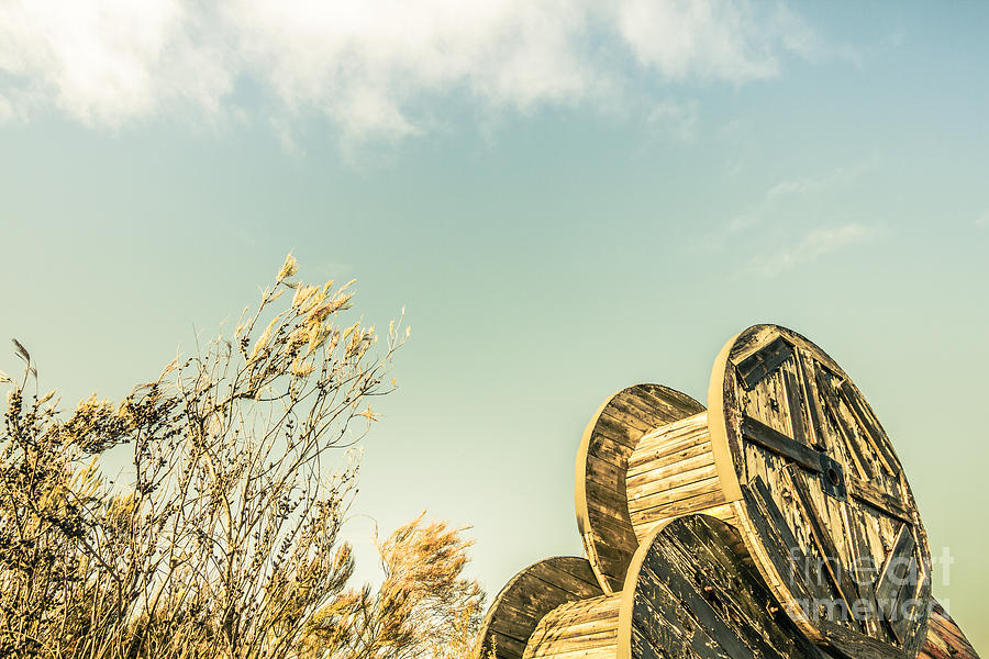 Vintage spools and farmyard skies Photograph by Jorgo Photography