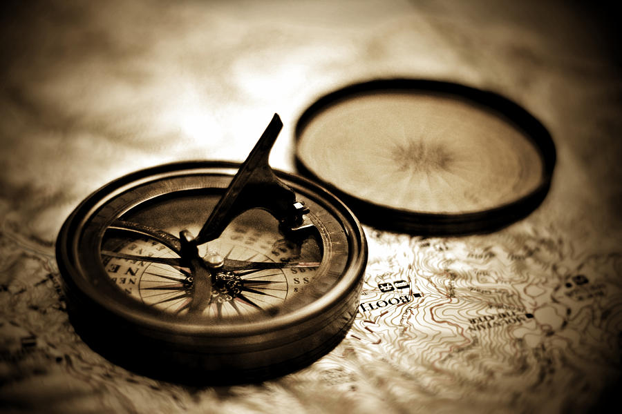 Vintage Sundial Compass On Top Of Map Photograph by Serena King
