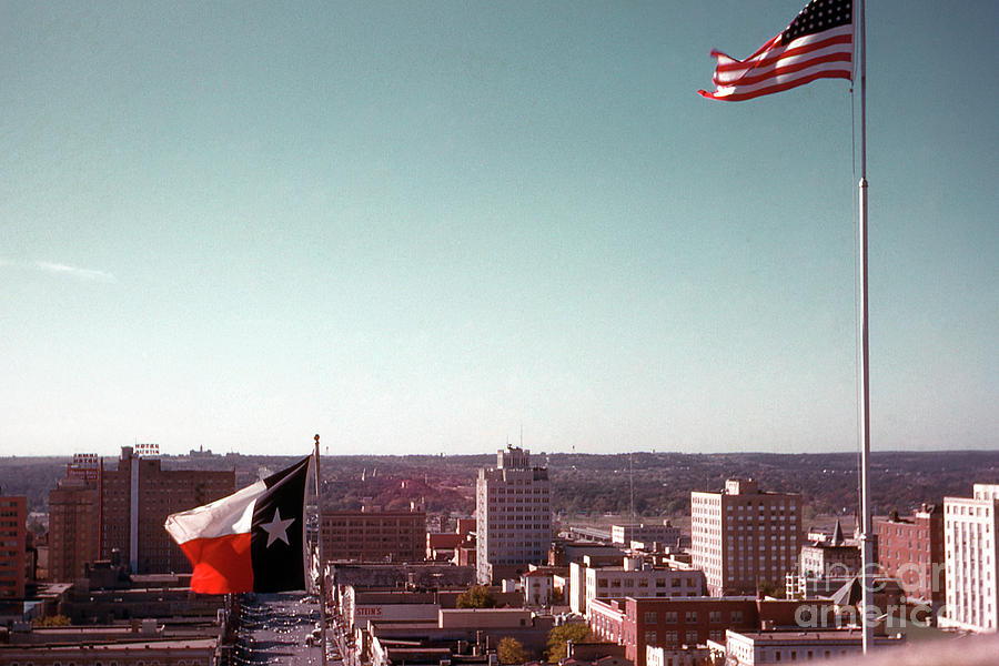 Vintage Photograph - Vintage view of the Texas and USA flags flying on top of Texas State Capitol by Dan Herron