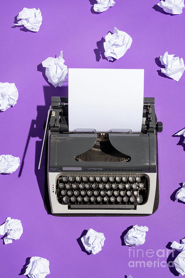 Vintage writing machine with a blank sheet of paper Photograph by Michal Bednarek