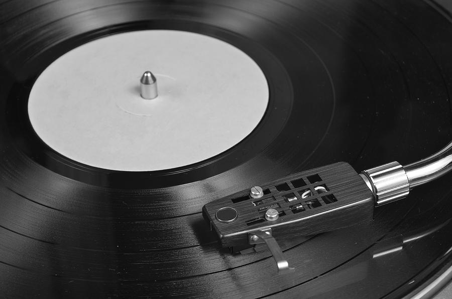Vintage Photograph - Vinyl Record Playing on a Turntable Overview by Angelo DeVal