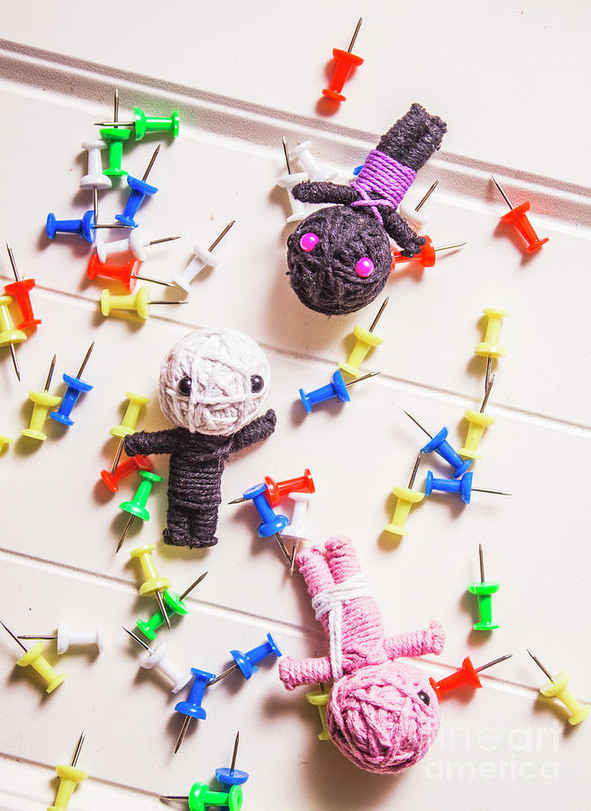 Voodoo Dolls Surrounded By Colorful Thumbtacks Photograph by Jorgo Photography