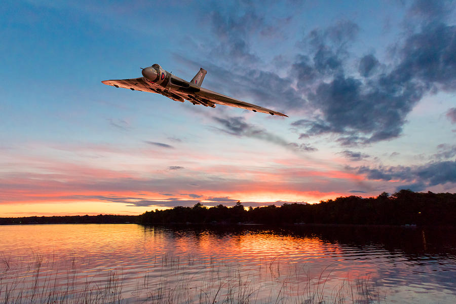 Vulcan low over a sunset lake Digital Art by Gary Eason