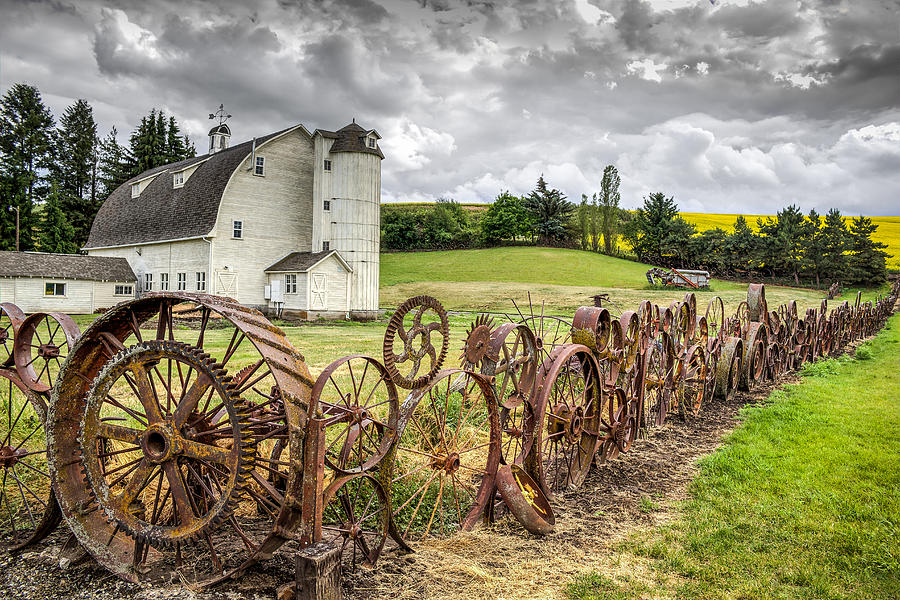 Wagon Wheel fence at the Dahmen Barn Photograph by Brad Stinson