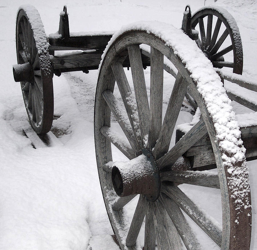 Wagon Wheels in Snow Photograph by Linda Drown