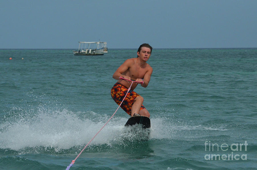 Wakeboarder in a Tight Crouch Off the Coast of Aruba Photograph by DejaVu Designs