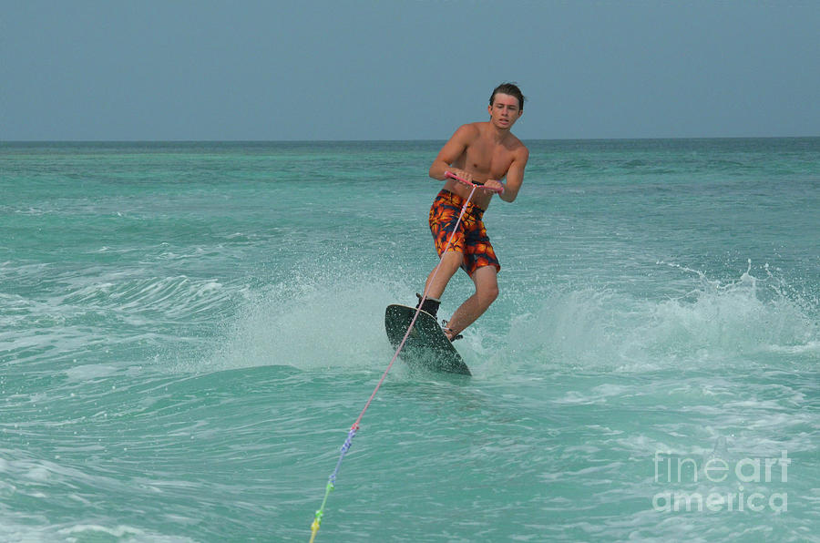 Wakeboarding Ollie Over a Wave in Aruba Photograph by DejaVu Designs