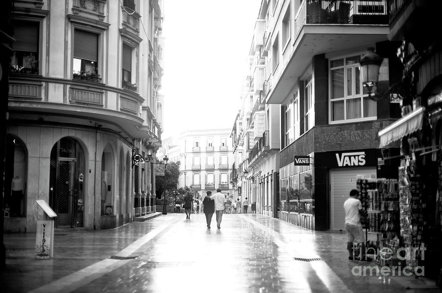 Walking on Calle Cister in Malaga Photograph by John Rizzuto