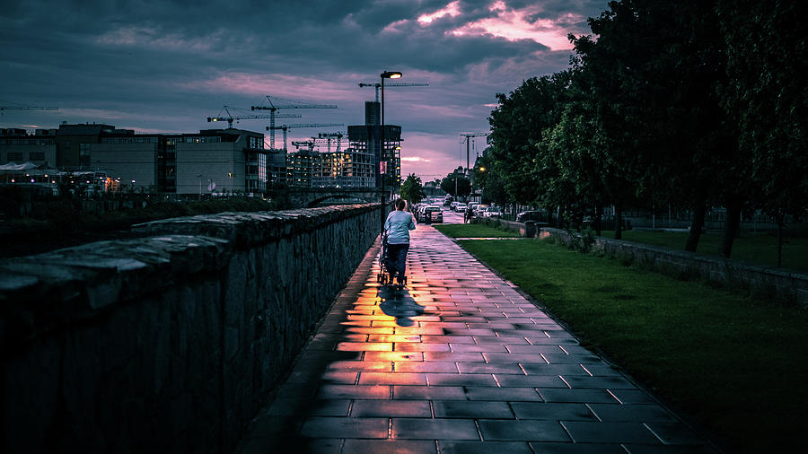 Walking the baby - Dublin, Ireland - Color street photography Photograph by Giuseppe Milo