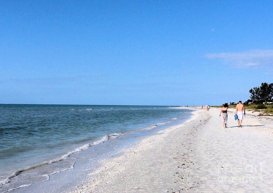 Walking the beach at Sanibel. Photograph by Janette Boyd
