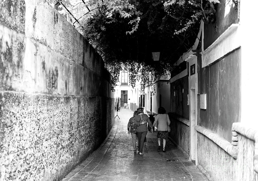 Walking the Old Streets of Seville Photograph by John Rizzuto