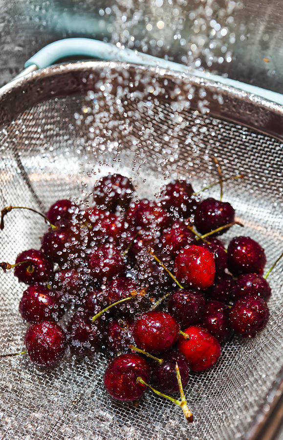 Washing Cherries Photograph by Jon Glaser