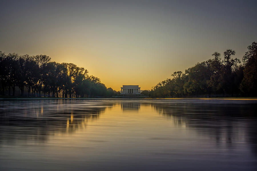 Washington Memorial Tower Reflecting In Reflective Pool At Sunse Photograph by Alex Grichenko